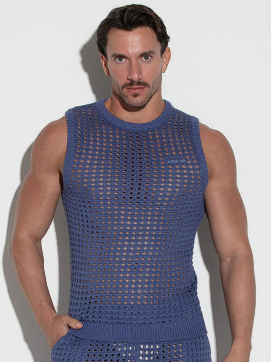 Man wearing a blue sleeveless knit outfit against a white background