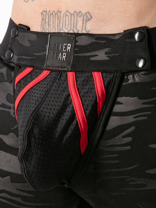 Black athletic boxer shorts with red accents and a visible brand label