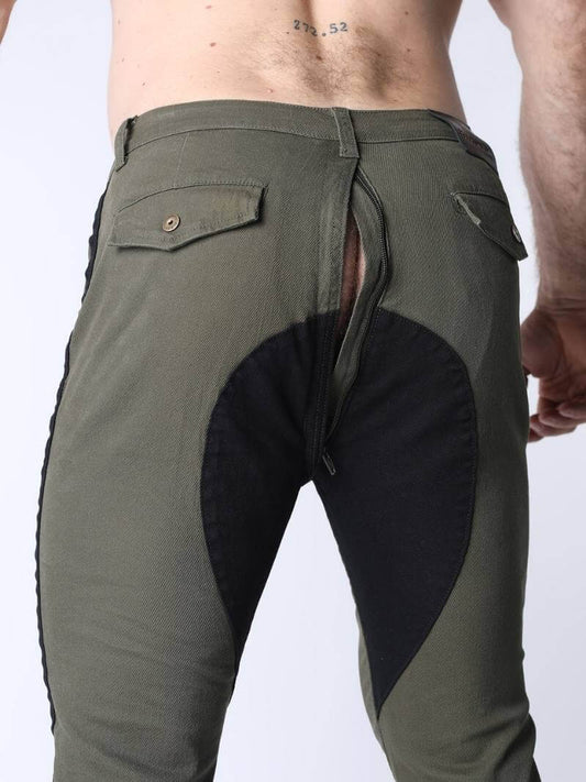 Green pants with black patch on a white background