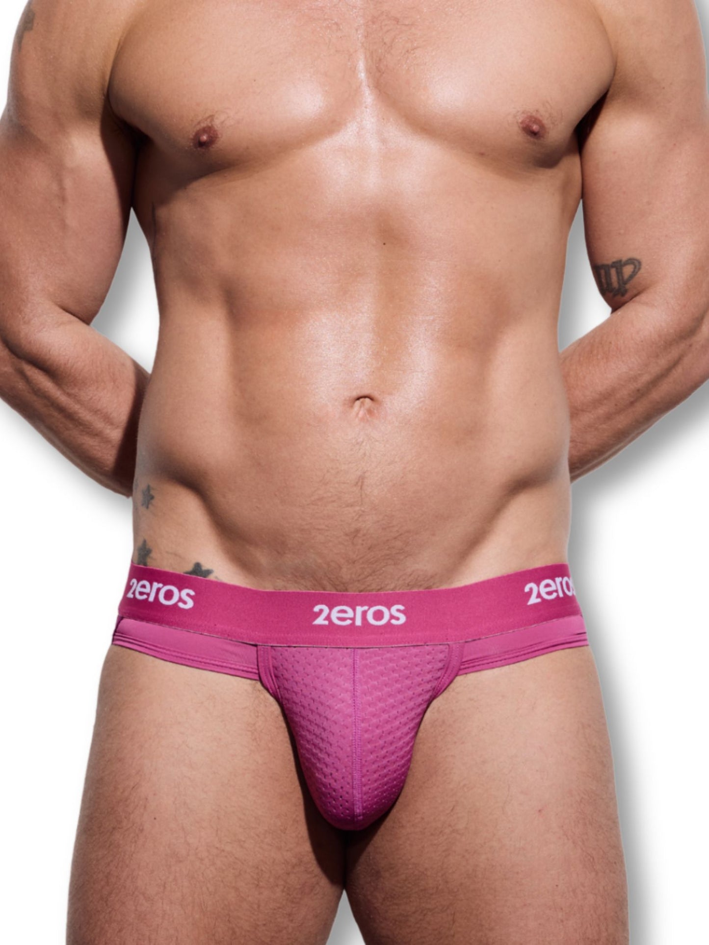 Man wearing pink '2eros' underwear on a white background