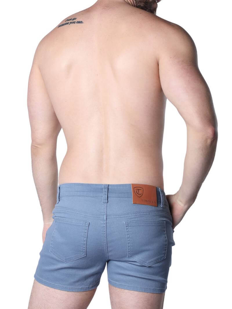 A pair of green Timoteo Berkeley cotton twill pocket shorts with a logo branding on the waistband, featuring a mid-thigh length, low-rise waist, zip-up fly, button fastening, belt loops, and five pockets.