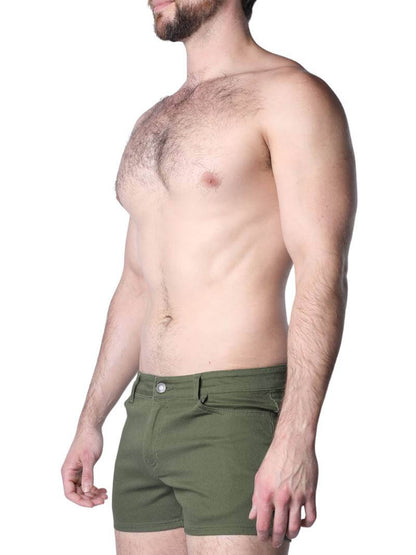 Green shorts worn by a person on a white background