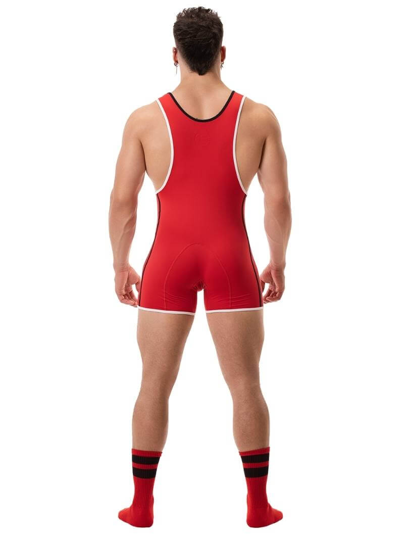 A person wearing a black wrestling singlet with Barcode Berlin branding on the left leg, featuring sporty side stripes.