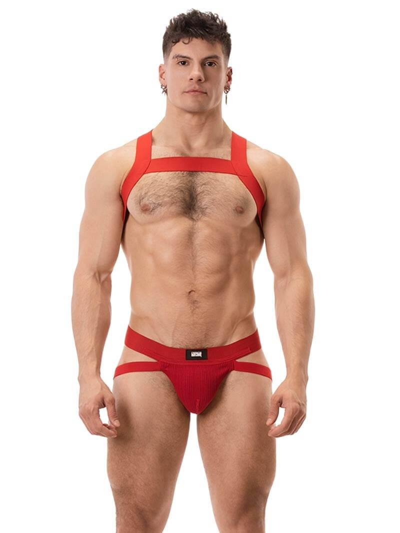 A white ribbed cotton butt lifting jockstrap by Barcode Berlin, featuring a sturdy thick waistband and elasticated jock straps, modelled by a male model.