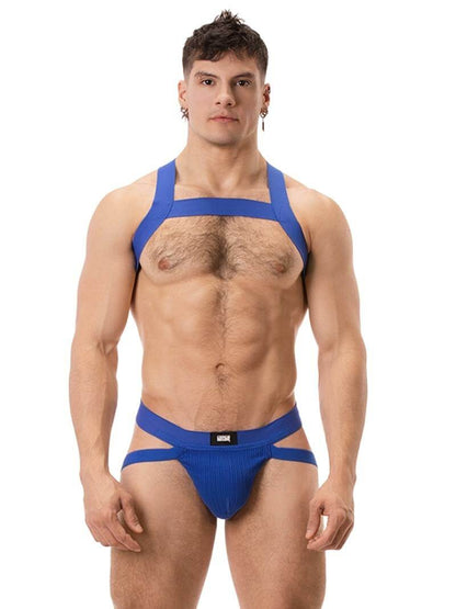 A red ribbed cotton butt lifting jockstrap by Barcode Berlin, featuring a sturdy thick waistband and elasticated jock straps, modelled by a male model.