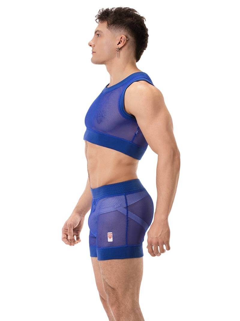 A man wearing a royal blue mesh crop top with a round neck and matching trims. The brand label 'BARCODE Berlin' is visible on the back.