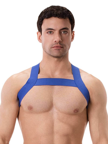 A man wearing a blue elastic chest harness with straps across the chest and over the shoulders.