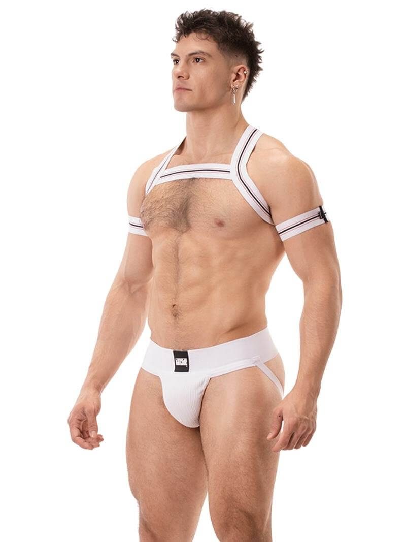 A model wearing a white Barcode Berlin Sergey ribbed cotton jockstrap, with the brand label visible on the waistband.