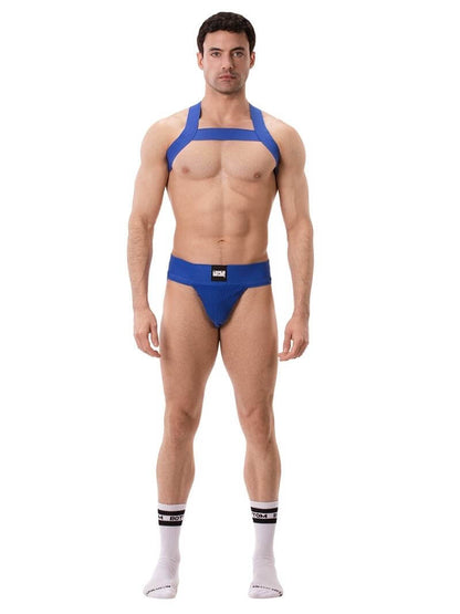 A model wearing a white Barcode Berlin Sergey ribbed cotton jockstrap, with the brand label visible on the waistband.