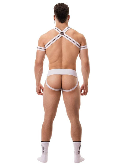 A model wearing a white Barcode Berlin Sergey ribbed cotton jockstrap, with the brand label visible on the waistband.