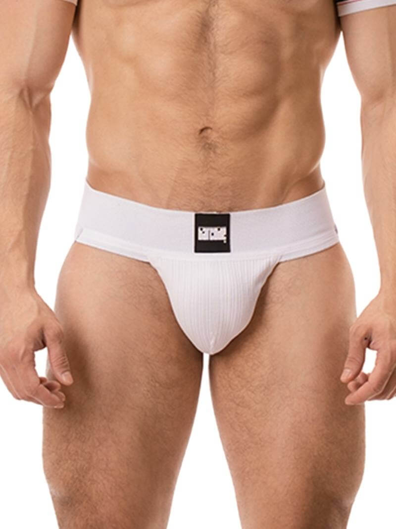 A model wearing a white Barcode Berlin Sergey ribbed cotton jockstrap, with the brand label visible on the waistband.