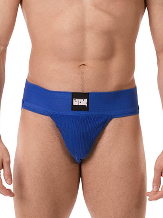 A model wearing a blue Barcode Berlin Sergey ribbed cotton jockstrap, with the brand label visible on the waistband.
