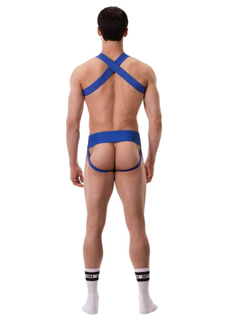 A model wearing a white Barcode Berlin Sergey ribbed cotton jockstrap, with the brand label visible on the waistband.