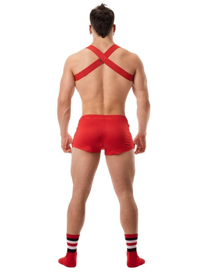 A model wearing black short-legged shorts with sporty side stripes and a drawstring waist.