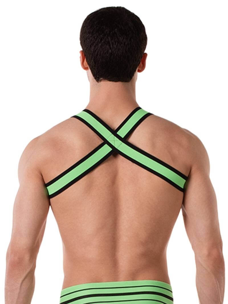 A model wearing a neon green and black elastic chest harness with the BARCODE Berlin brand emblem on the front horizontal strap.