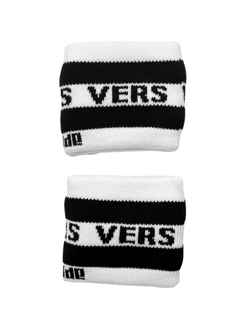 A hand holding two white wristbands with the text 'Top' written in black lettering and a black stripe design.