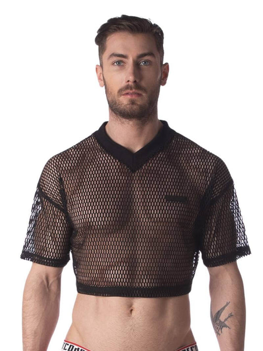 A male model wearing a black semi-see-through mesh fishnet crop top with short sleeves and a v-neck, branded with 'BARCODE'.