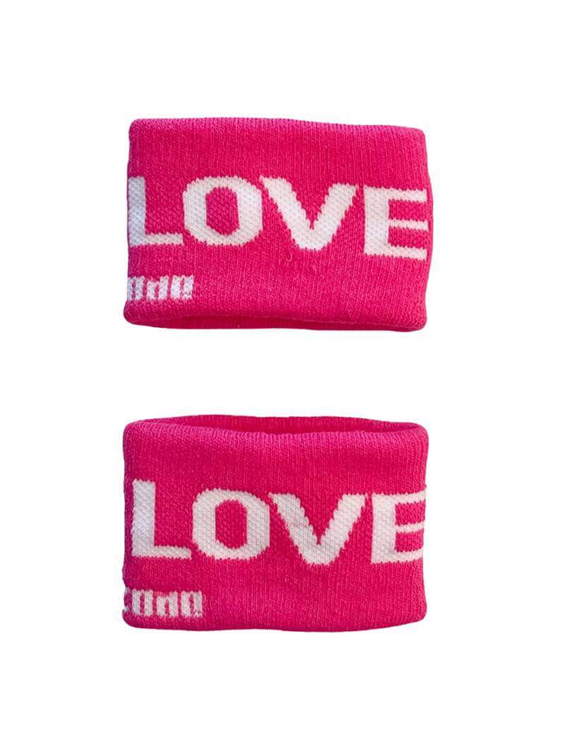 A hand holding two white wristbands with gay pride stripes