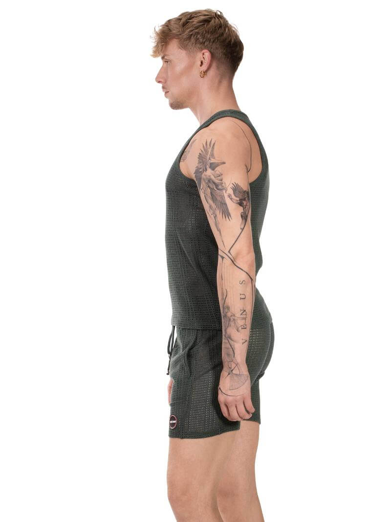Person wearing a green athletic outfit on a white background
