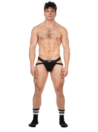 Man wearing a black men's gay jockstrap on a white background
