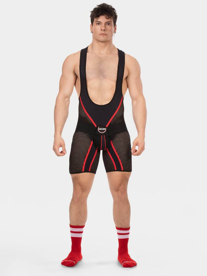 Man wearing a black and red wrestling singlet on a white background
