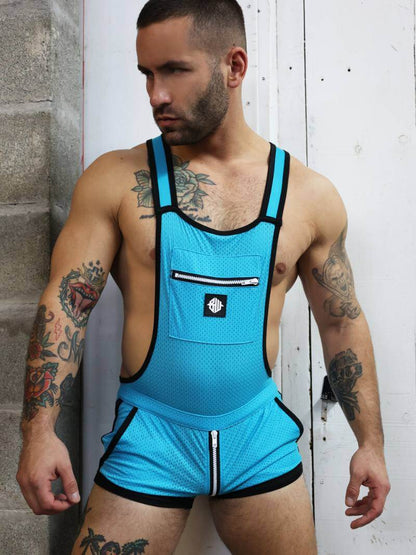 Man wearing a blue athletic outfit with tattoos on his arms and chest.