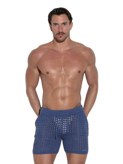 Man wearing blue knitted boxer shorts on a white background