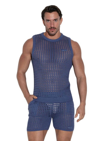 Man wearing a blue sleeveless top and shorts set on a white background