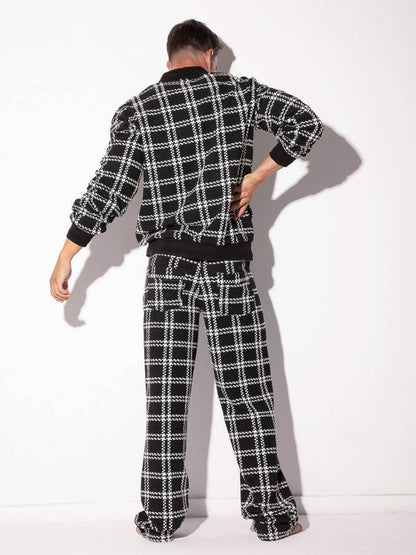 Person wearing a black and white plaid outfit on a white background