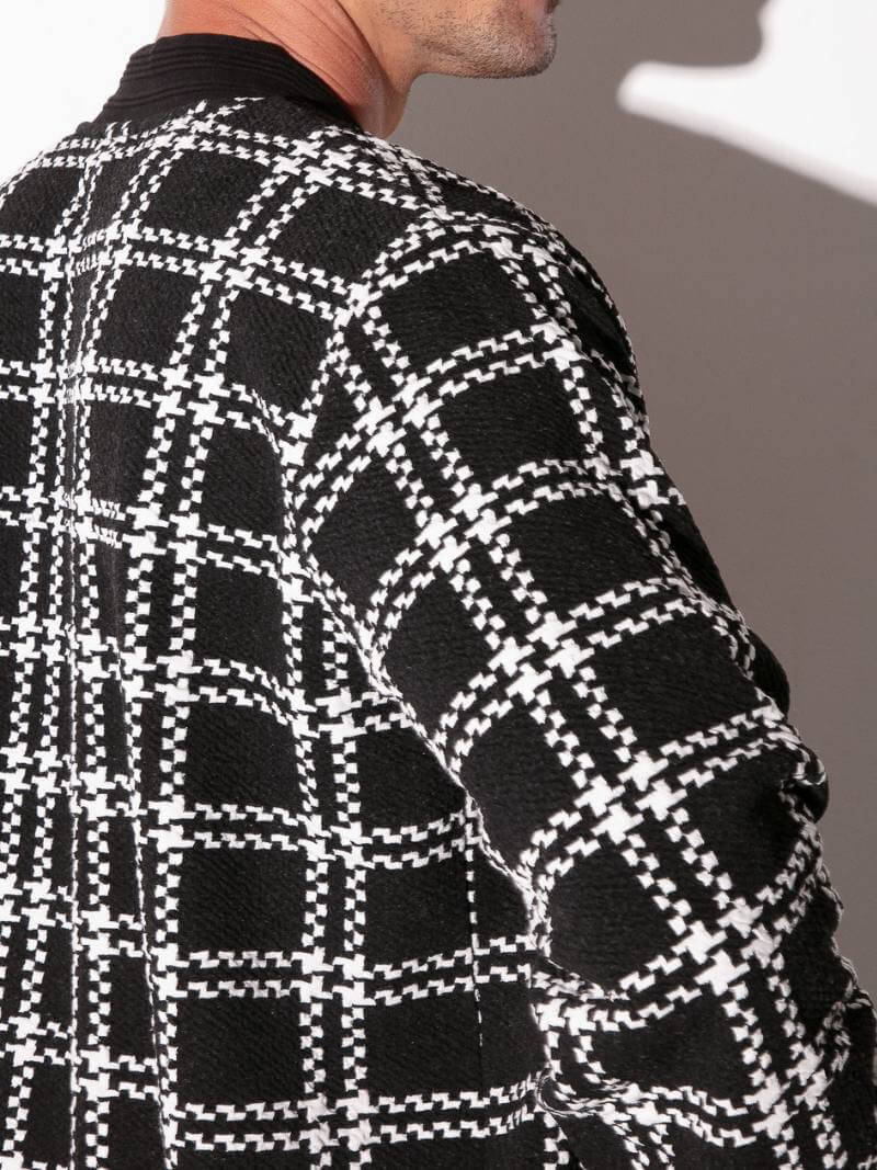 Close-up of a black and white checkered pattern on a garment.