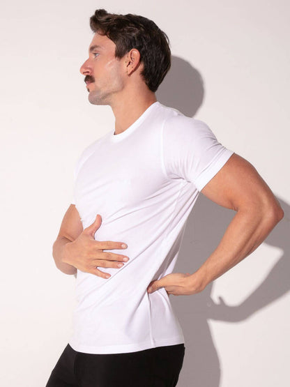 Man wearing a white t-shirt against a plain background