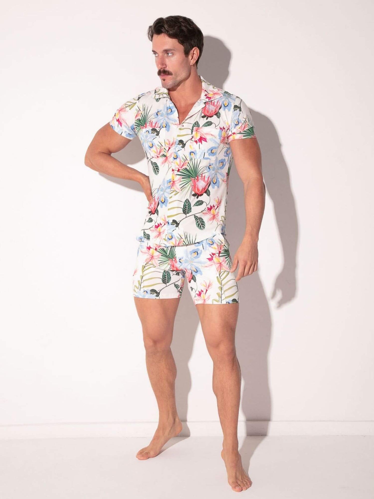 Man wearing a floral outfit set on a white background