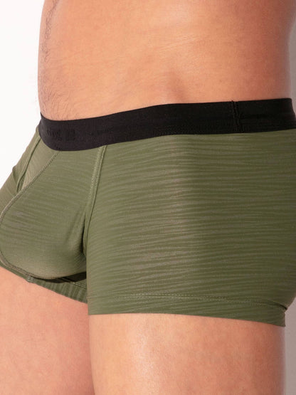 Green boxer briefs with black waistband on a neutral background