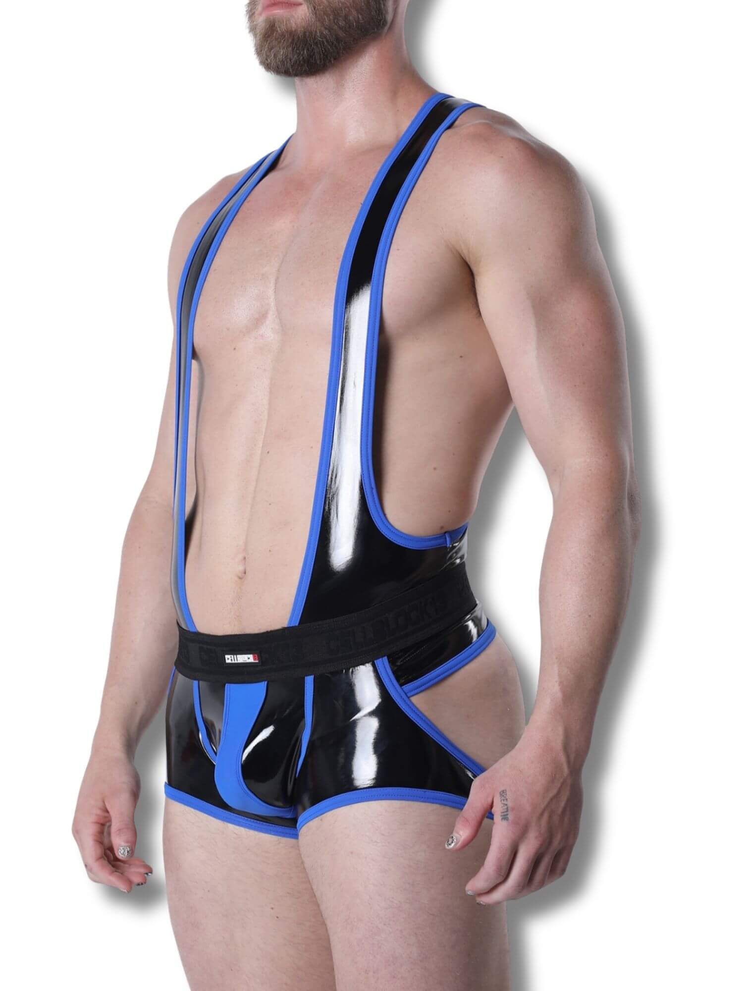 Man wearing a black and blue latex outfit on a white background