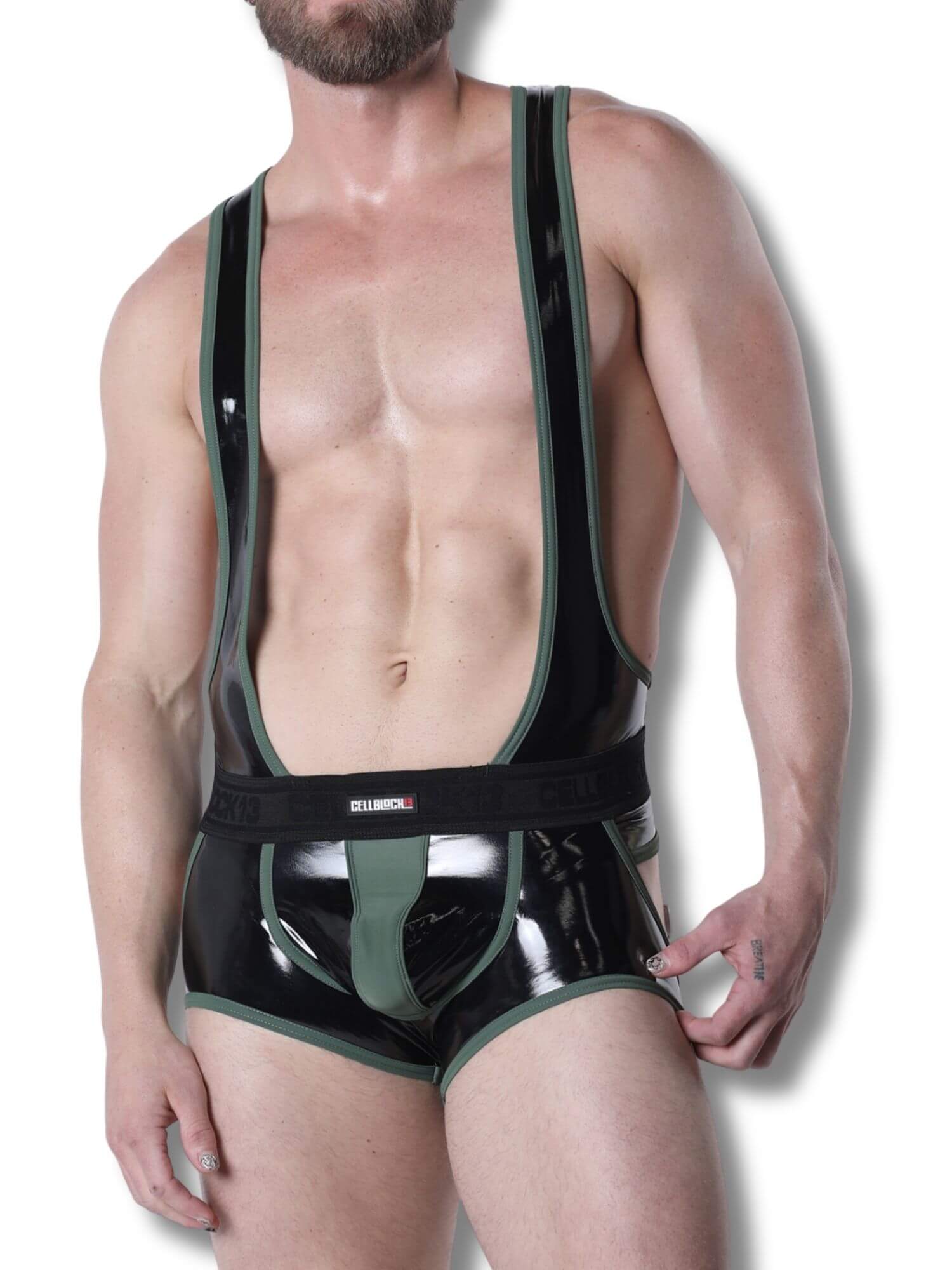 Man wearing a black and green latex outfit on a white background