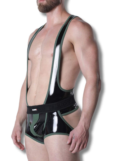 Man wearing a black and green latex outfit against a white background