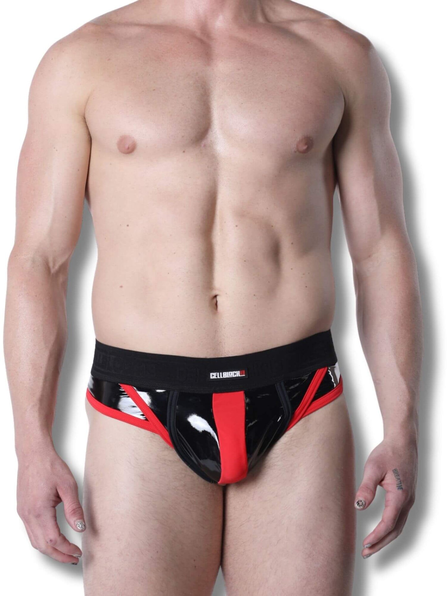 Man wearing a black and red thong on a white background