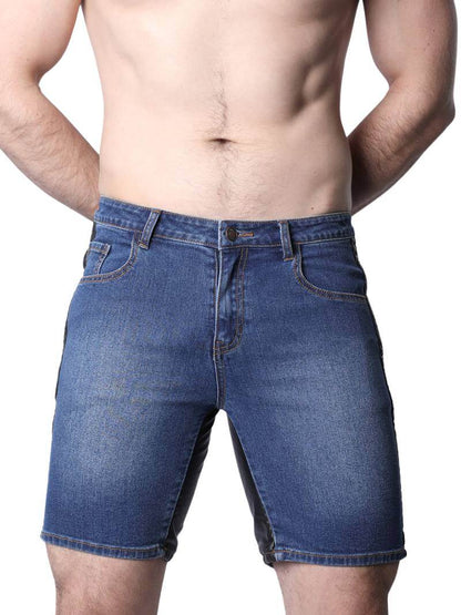 Blue denim shorts worn by a person on a white background
