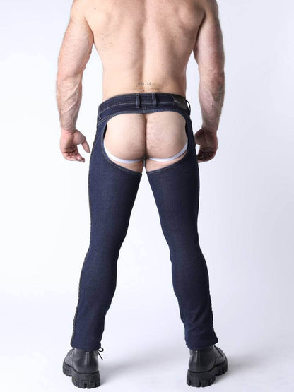 Person wearing dark blue jeans with a white background