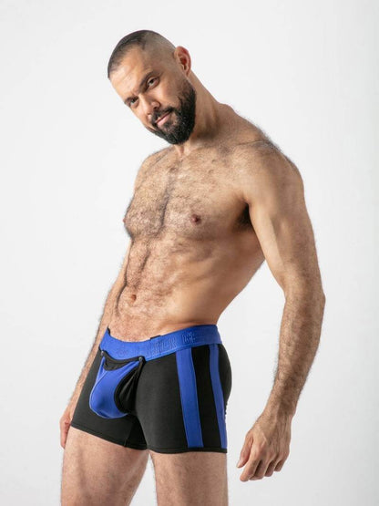 Man wearing black and blue athletic shorts on a white background