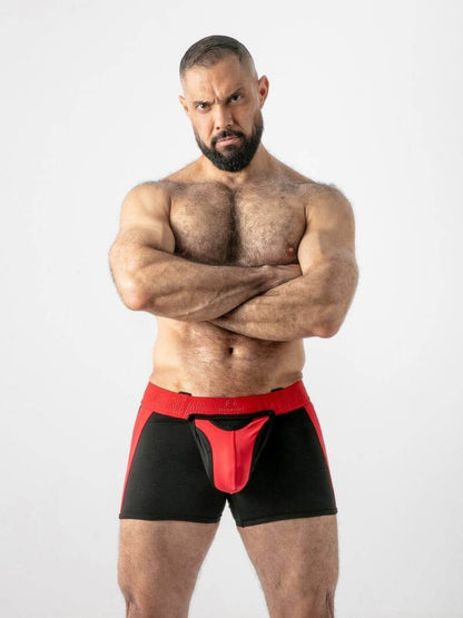 Man wearing black and red underwear with a white background