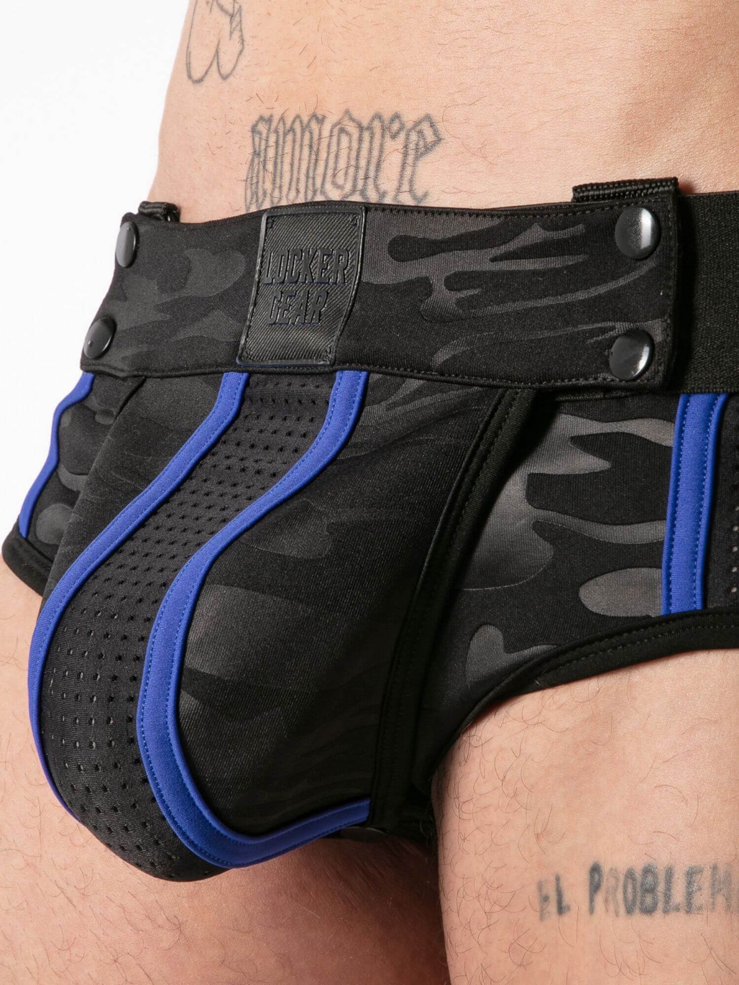 Black camouflage jock brief with blue accents worn by a person.