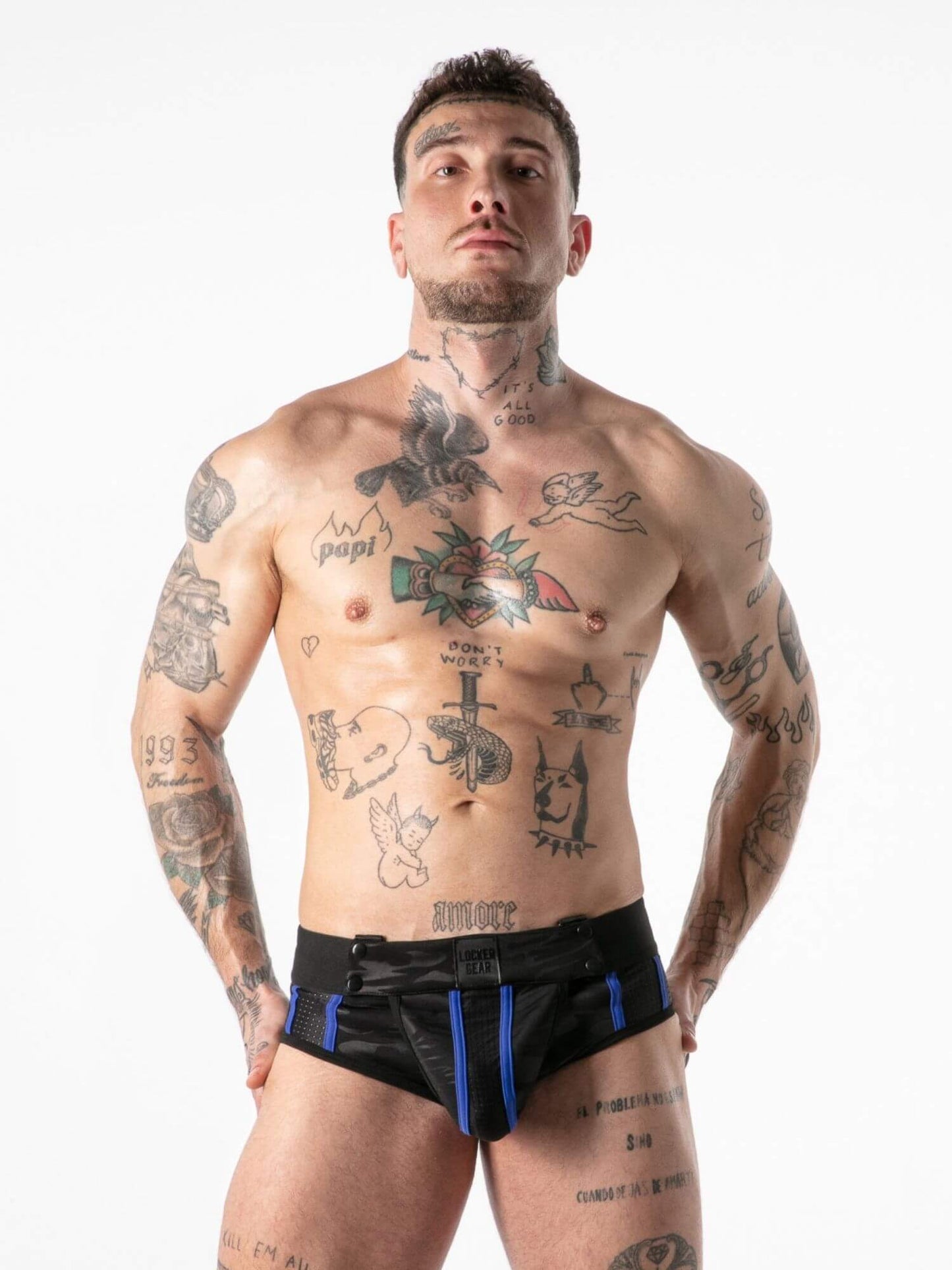 Man wearing black underwear with blue waistband on a white background