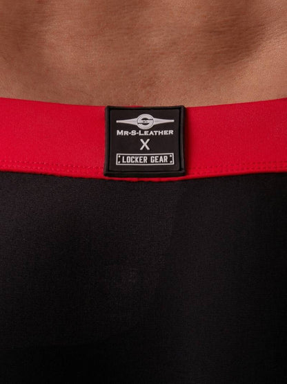 Red belt with a black label on a black background