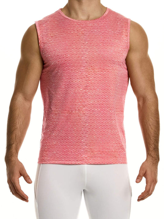Man wearing a pink sleeveless shirt and white pants on a white background