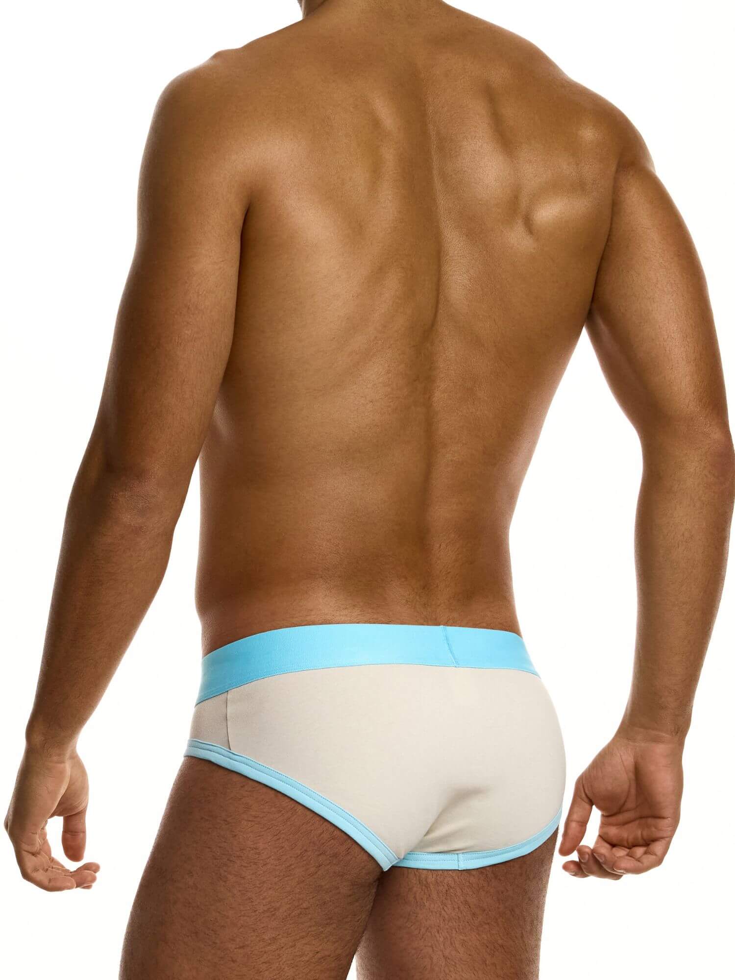 Man wearing beige underwear with blue waistband on a white background