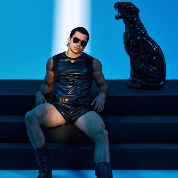 Model wearing MODUS VIVENDI leather look Prince Albert tank and shorts
