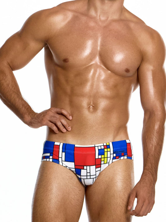 Man wearing a colorful geometric patterned swimsuit on a white background