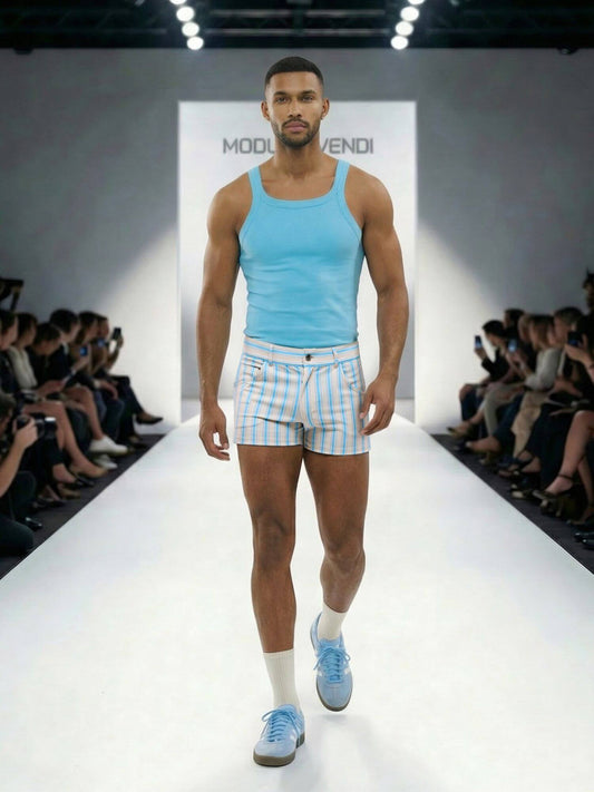 Model walking on a runway wearing a MODUS VIVENDI  light blue aqua tank top and Balanced pocket shorts
