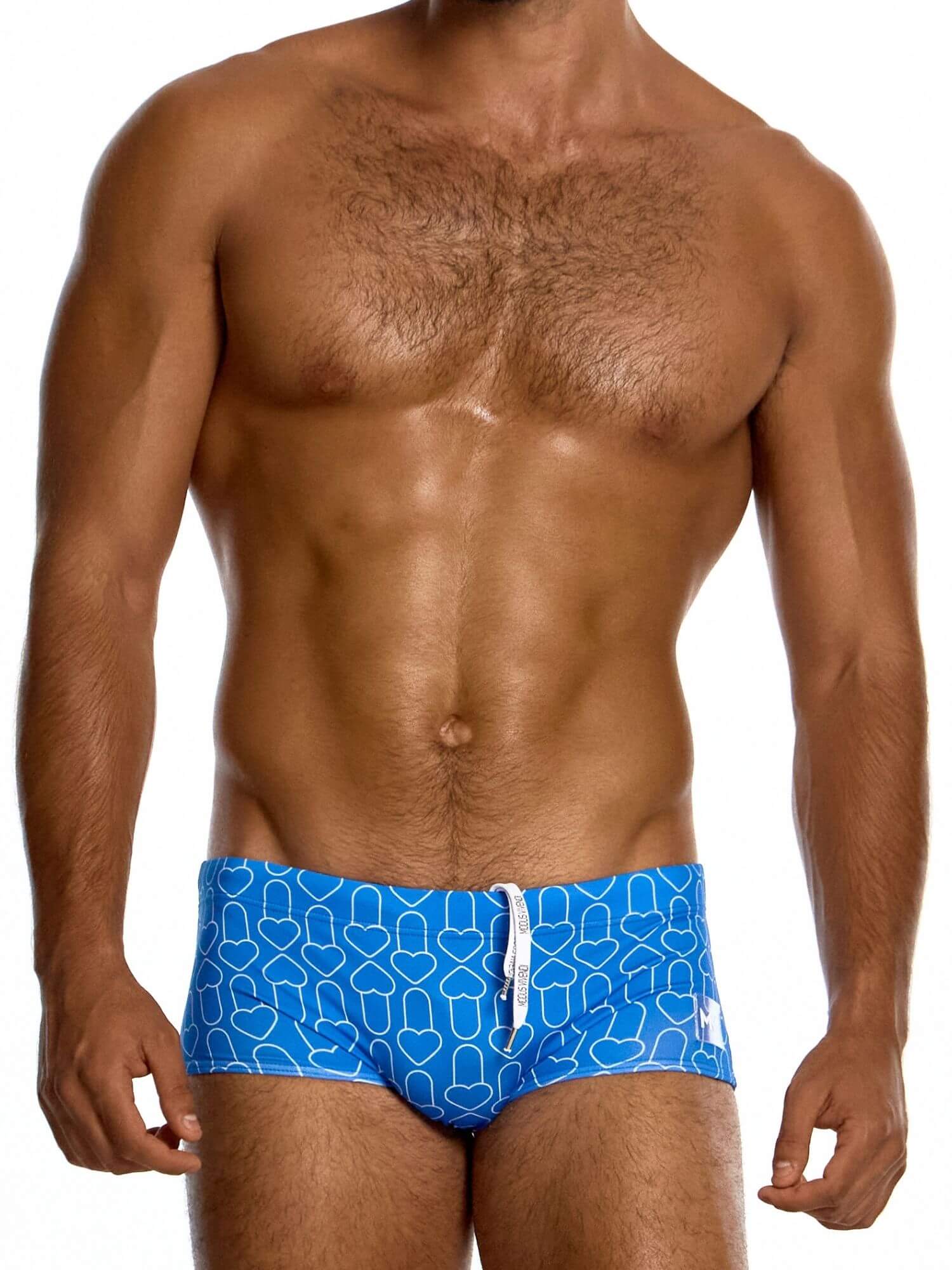Man wearing blue swim trunks with a geometric pattern on a white background